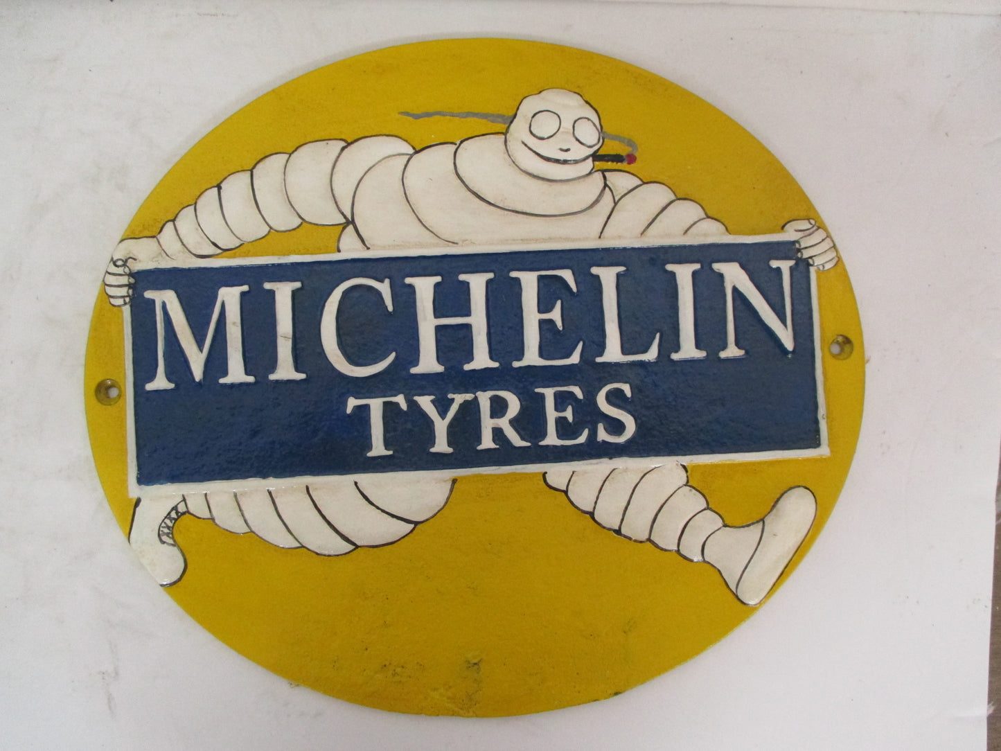 Tire Man Smoking Sign - oval